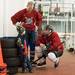 Five-year-old Noah Allen gives some advice to firefighters Dan Burke and Randy Menard in between periods.
Courtney Sacco I AnnArbor.com 